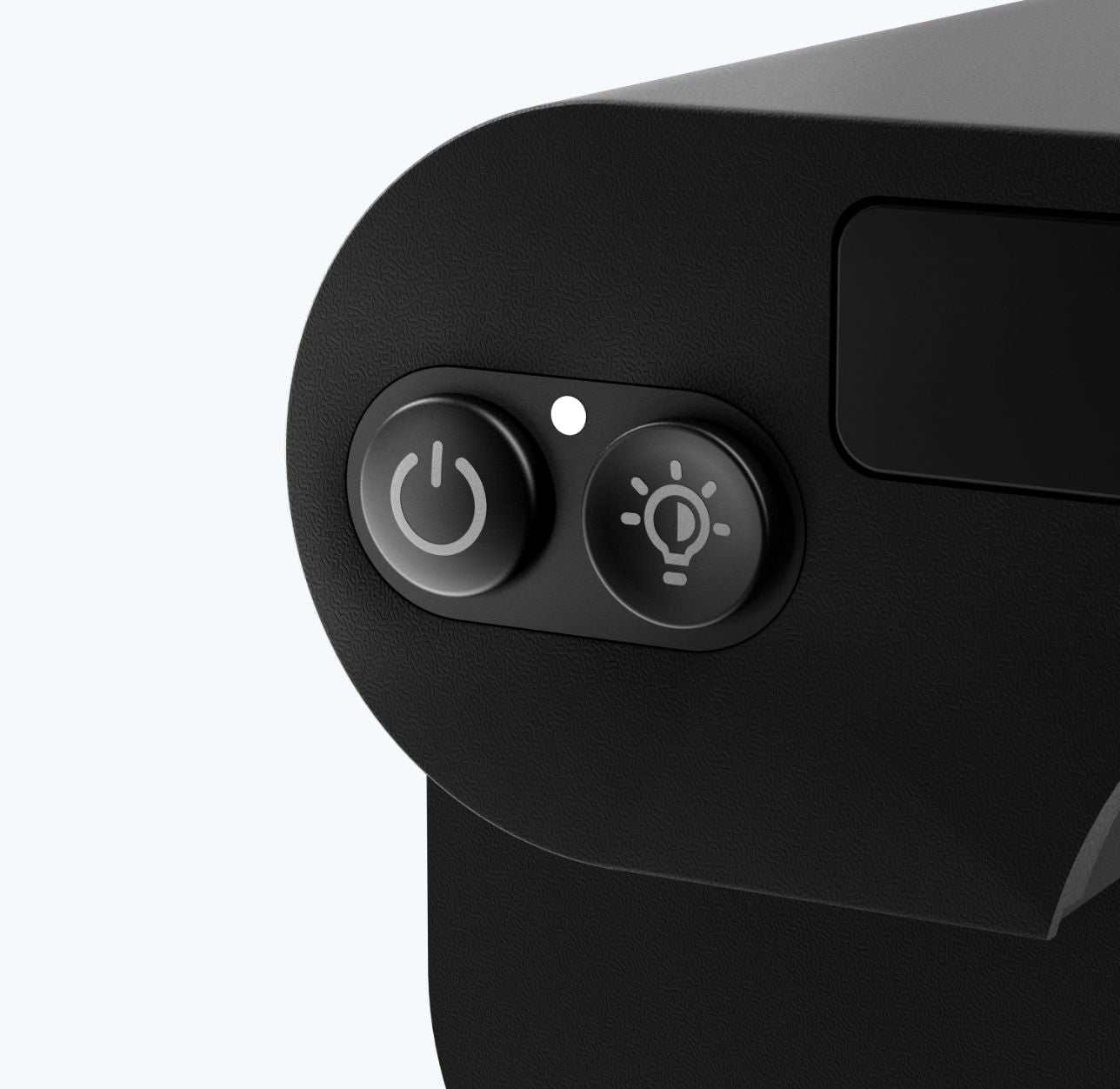 Close-up of power and light control buttons on Solvia 8x32 device