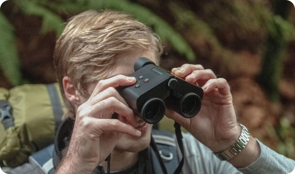 A man using Solvia 8x32 binoculars