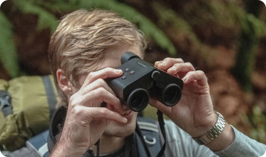 A man using Solvia 8x32 binoculars
