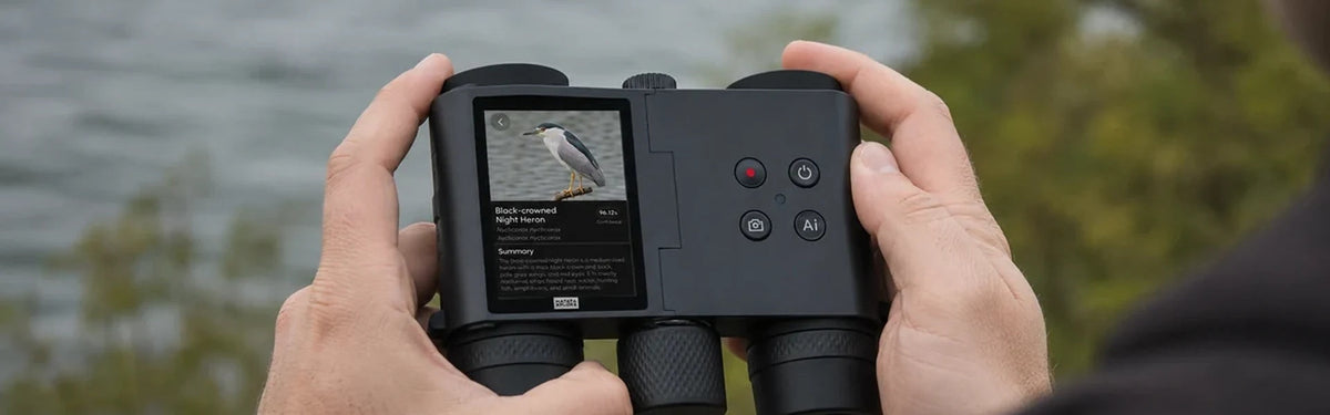Person holding the MatataXplore Solvia 8x32 , a pair of binoculars with camera for bird watching , outdoors with a bird identification result on the screen.