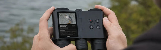 Person holding the MatataXplore Solvia 8x32 , a pair of binoculars with camera for bird watching , outdoors with a bird identification result on the screen.