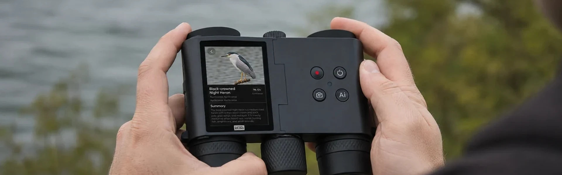 Person holding the MatataXplore Solvia 8x32 , a pair of binoculars with camera for bird watching , outdoors with a bird identification result on the screen.