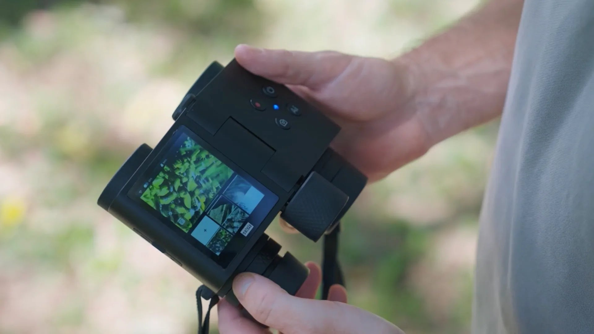 Hands holding binoculars outdoor