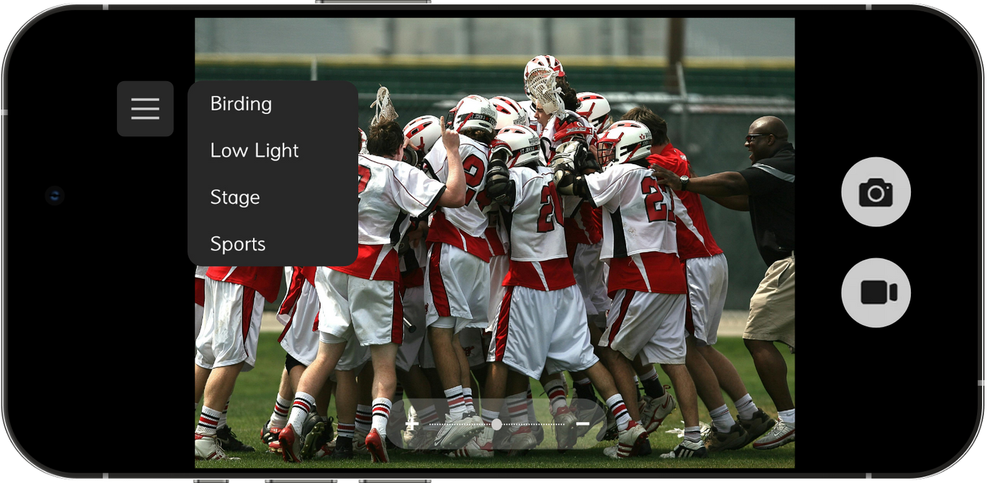 Phone screen showing binoculars app with a football game in progress on the screen.